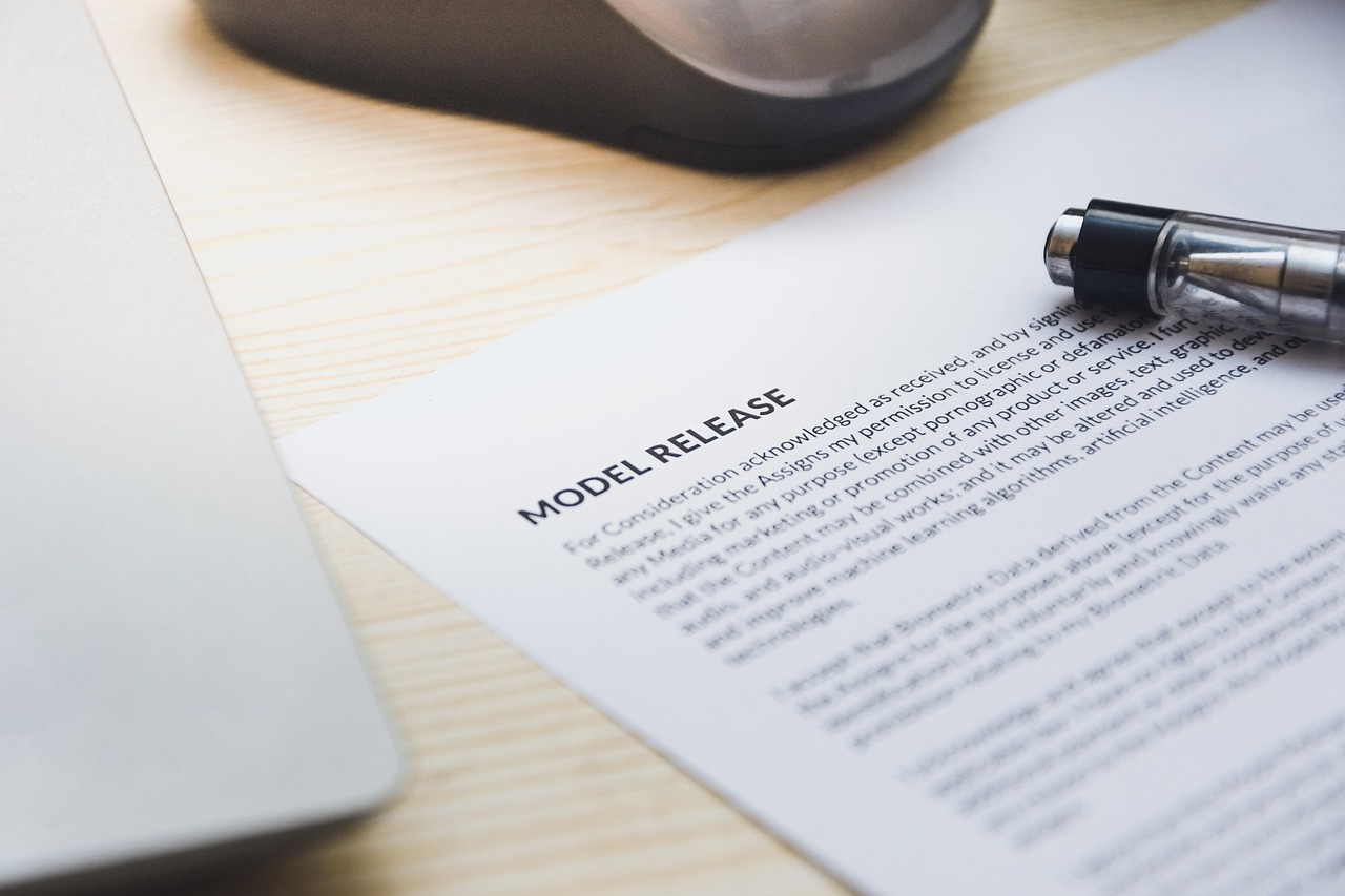 Funeral Policy vs Burial Society Signing document desk pen