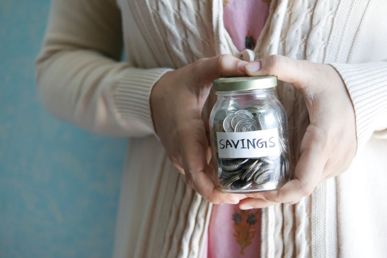 OUTsurance Funeral Cover Saving coins jar