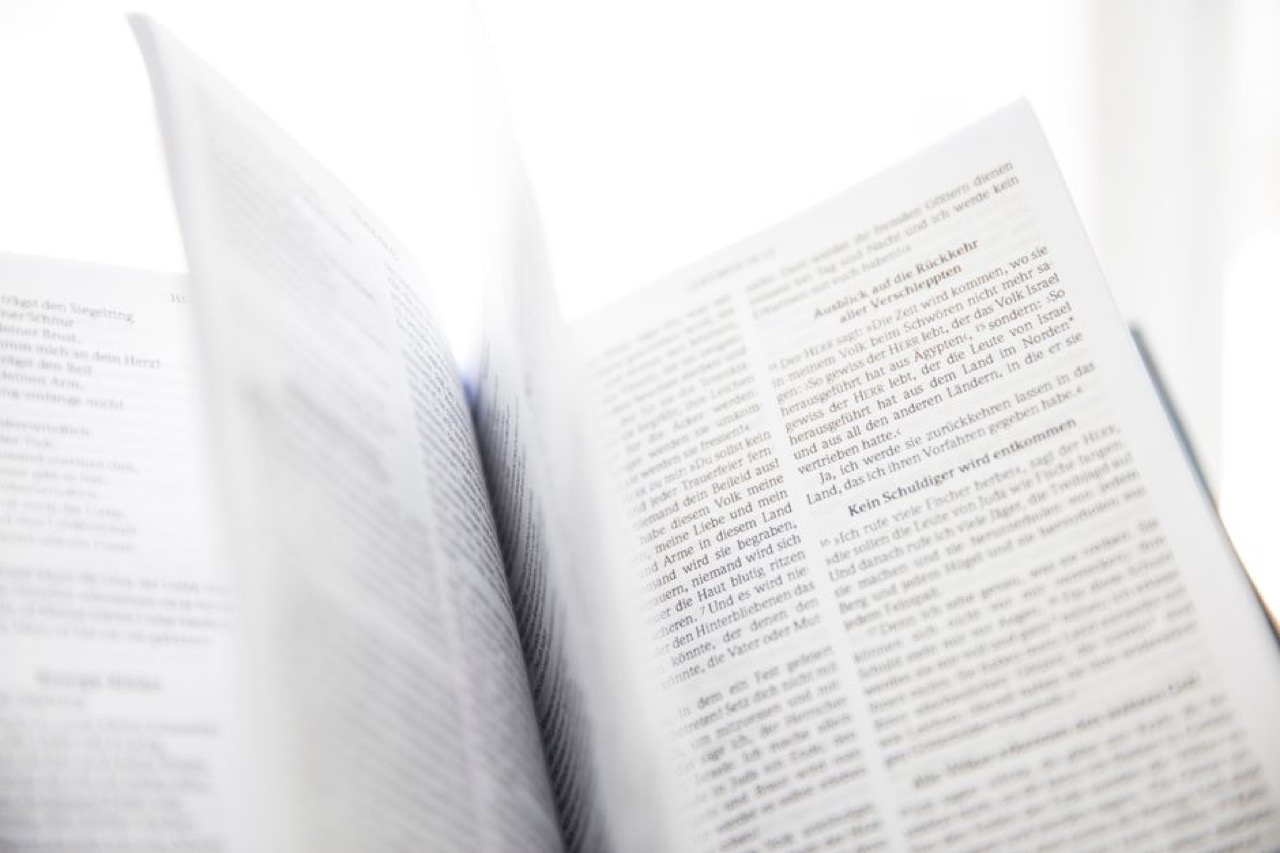 Funeral Blues - meaning and when to read it Bible open soft light