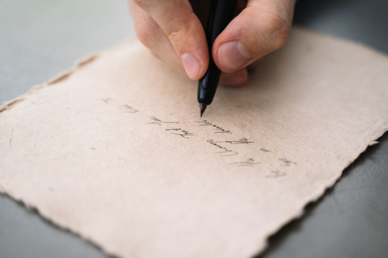 Funeral flower arrangements explained Handwriting letter close up