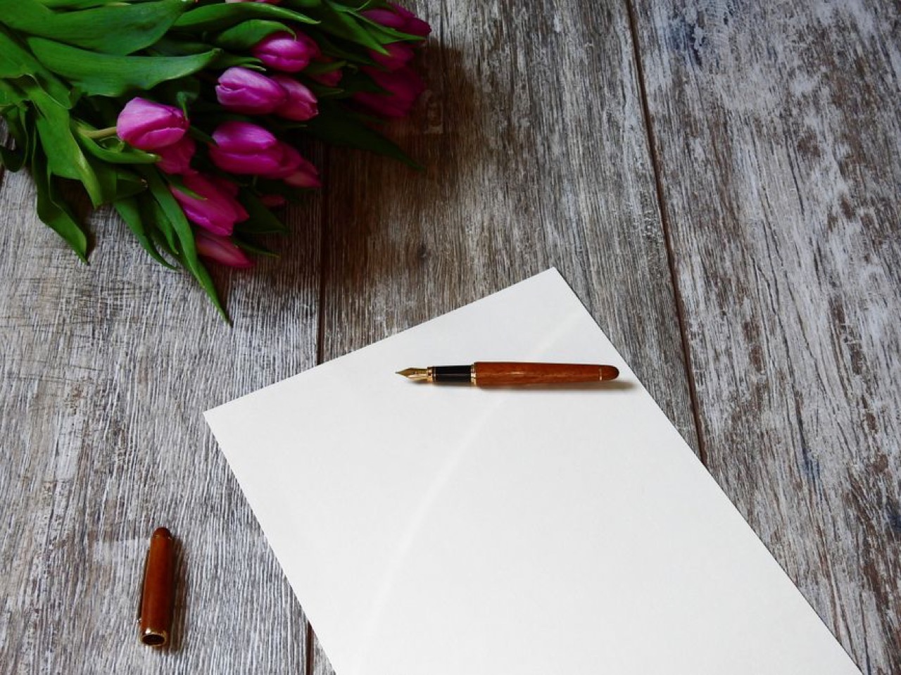 Writing a funeral speech or tribute Pen and paper desk